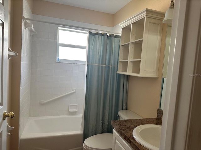 full bathroom with vanity, toilet, and shower / tub combo with curtain