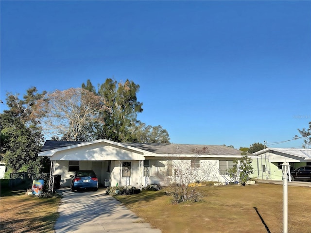 single story home featuring a carport