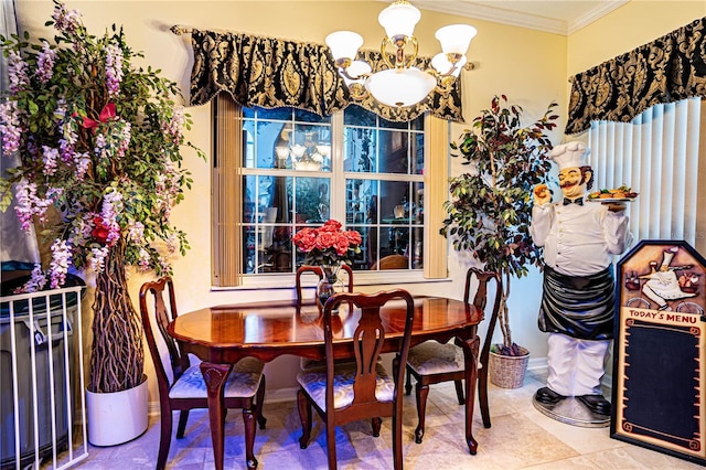 tiled dining space with crown molding and a chandelier