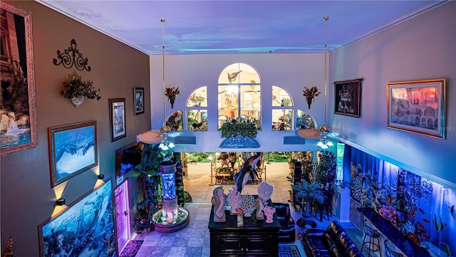 dining space featuring ceiling fan and ornamental molding