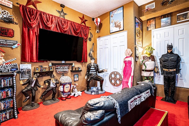 living room with carpet and a textured ceiling