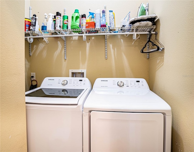 laundry area featuring washing machine and clothes dryer