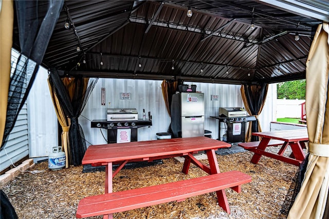 exterior space with a gazebo and a grill