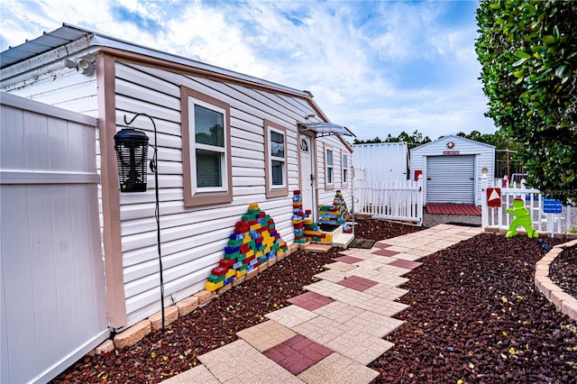 view of side of home with an outbuilding