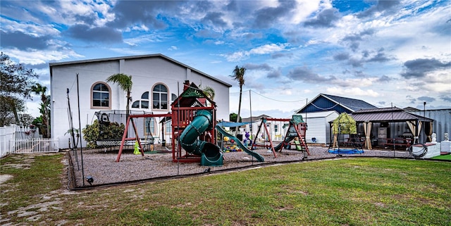 view of jungle gym with a gazebo and a lawn