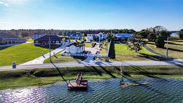 view of property's community with a boat dock and a water view