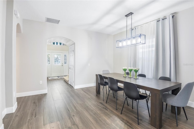 dining space featuring hardwood / wood-style floors