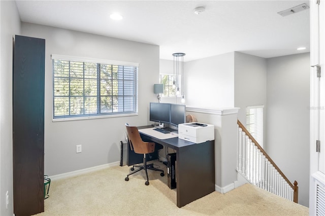 office featuring plenty of natural light and light carpet