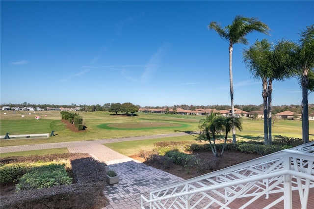 view of property's community with a lawn