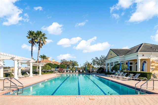 view of swimming pool with a patio area and a pergola