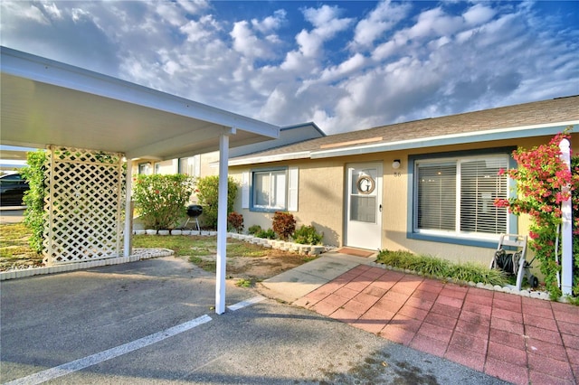 exterior space featuring a carport