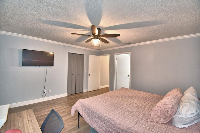 bedroom with ceiling fan, dark hardwood / wood-style floors, and ornamental molding