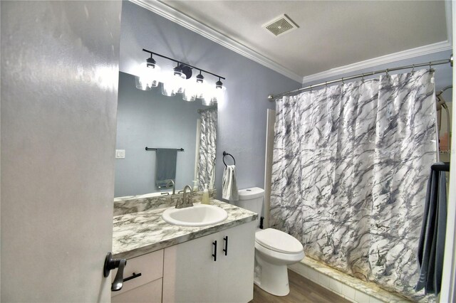 bathroom featuring a shower with curtain, vanity, toilet, and ornamental molding