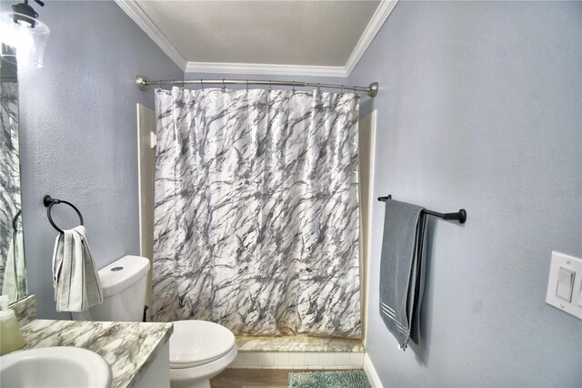 bathroom featuring vanity, toilet, a shower with shower curtain, and ornamental molding