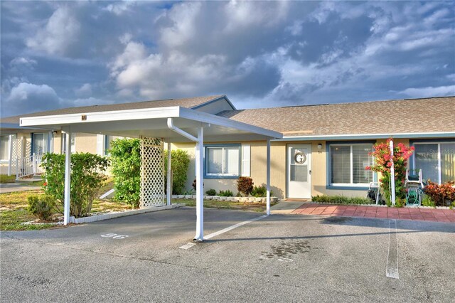 view of front of home with a carport