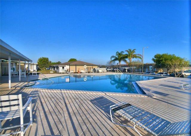 view of swimming pool with a patio