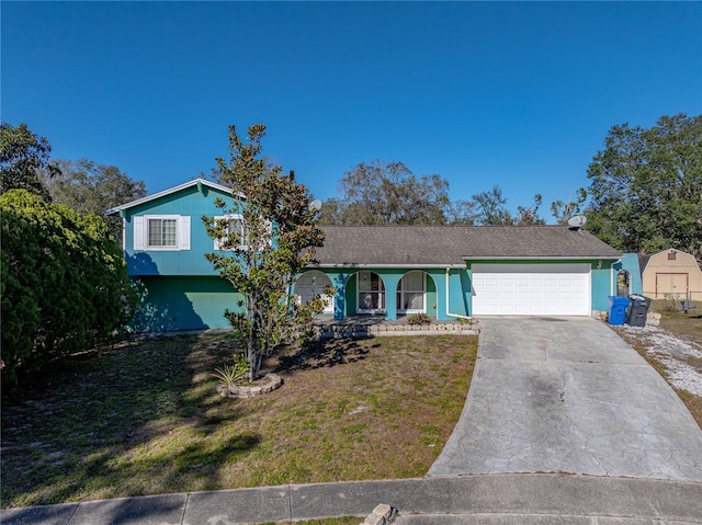 view of front of property with a garage and a front yard