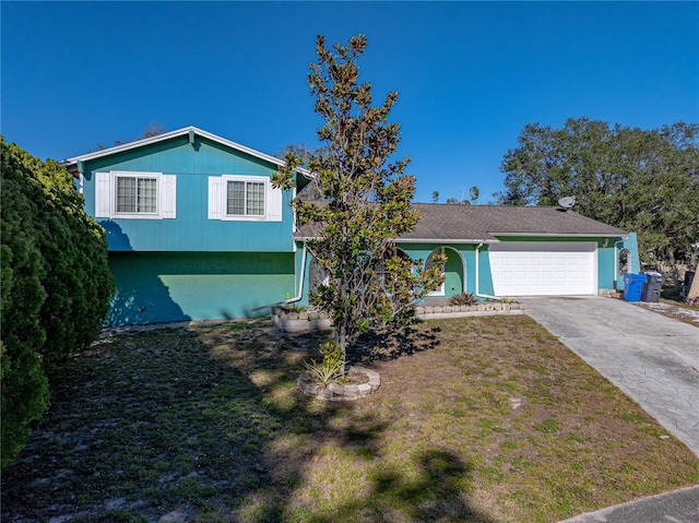 view of front facade with a garage and a front yard