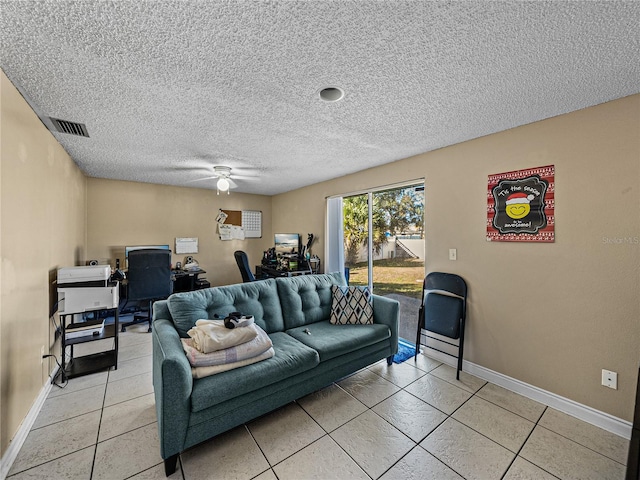 living room with ceiling fan and light tile patterned floors