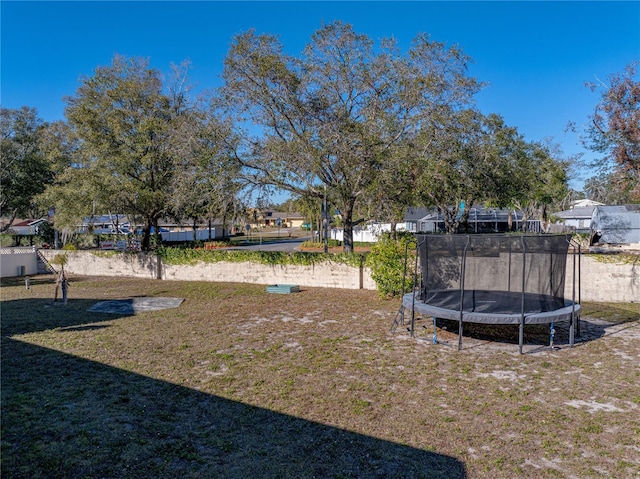 view of yard with a trampoline