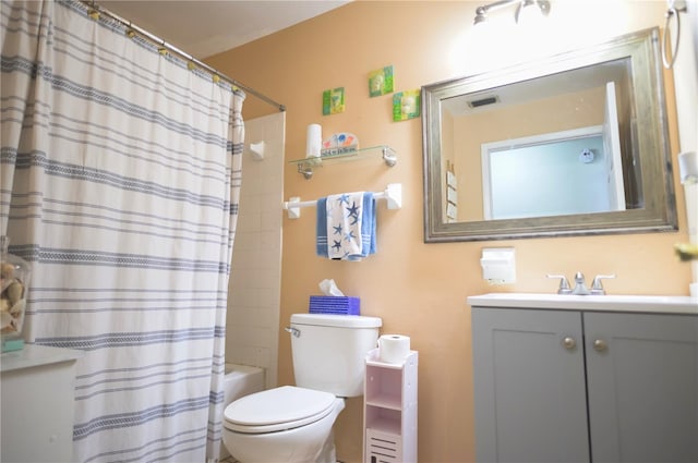 full bathroom with vanity, toilet, and shower / bath combo with shower curtain