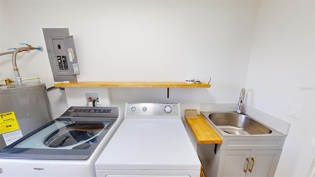 laundry area with cabinets, sink, electric panel, and washing machine and clothes dryer