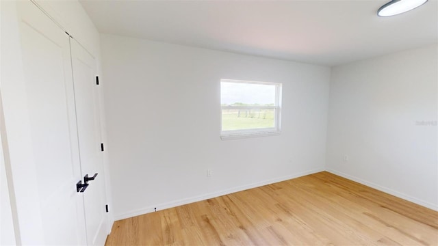 unfurnished bedroom featuring hardwood / wood-style flooring