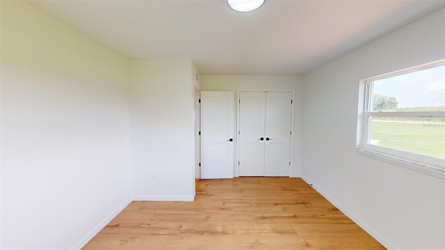 unfurnished bedroom with light hardwood / wood-style floors