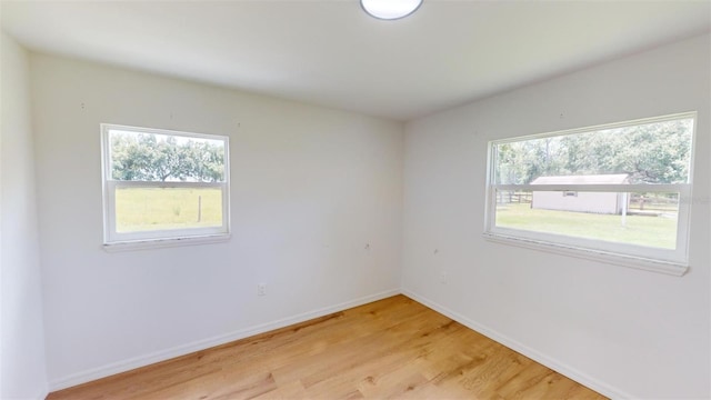 unfurnished room with light hardwood / wood-style floors