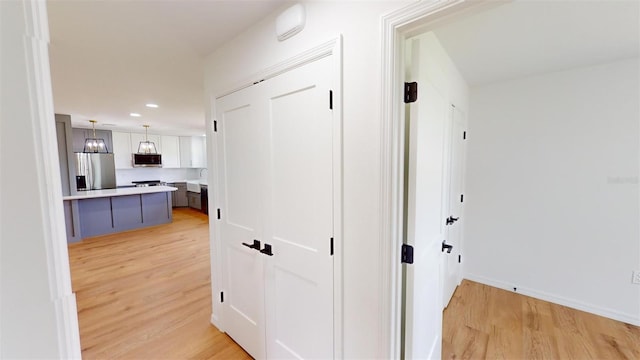 corridor featuring light hardwood / wood-style floors