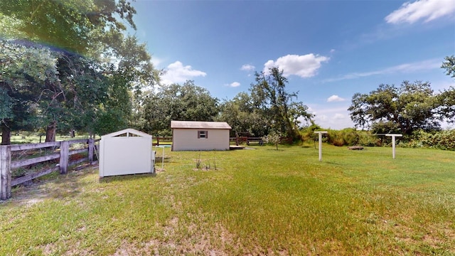 view of yard with a storage unit