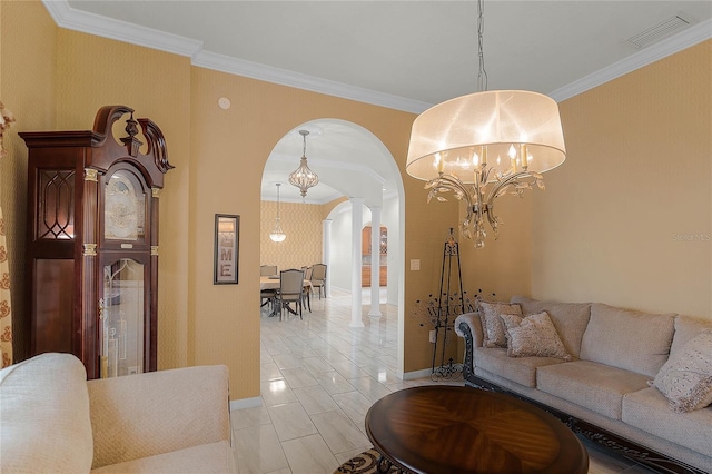 living room featuring crown molding and a chandelier