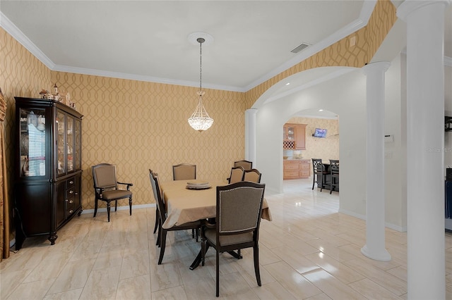 dining space with crown molding