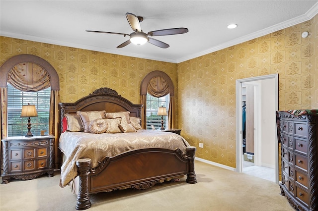 carpeted bedroom featuring ceiling fan, ornamental molding, and multiple windows