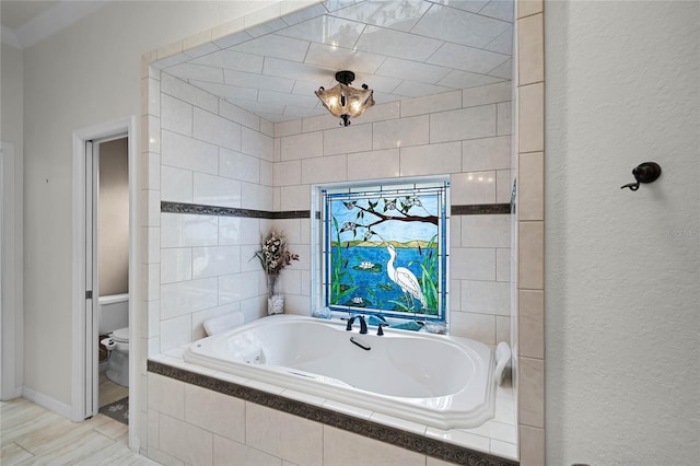 bathroom with toilet and a relaxing tiled tub