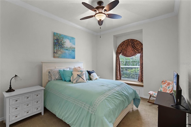 bedroom featuring ceiling fan, crown molding, and carpet floors