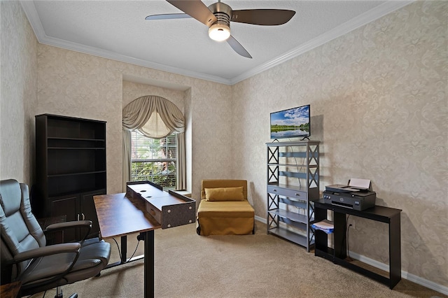 carpeted office space featuring ceiling fan, ornamental molding, and a textured ceiling