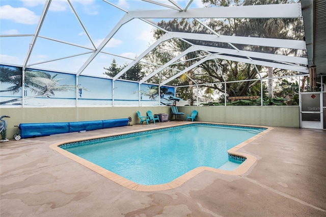 view of pool featuring a lanai and a patio area