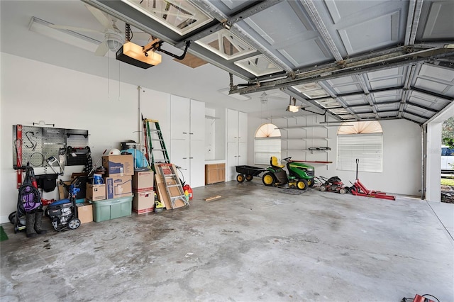 garage featuring a garage door opener and ceiling fan