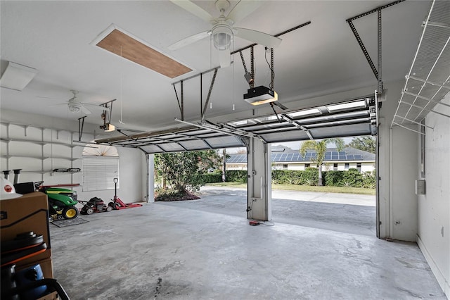 garage featuring ceiling fan and a garage door opener