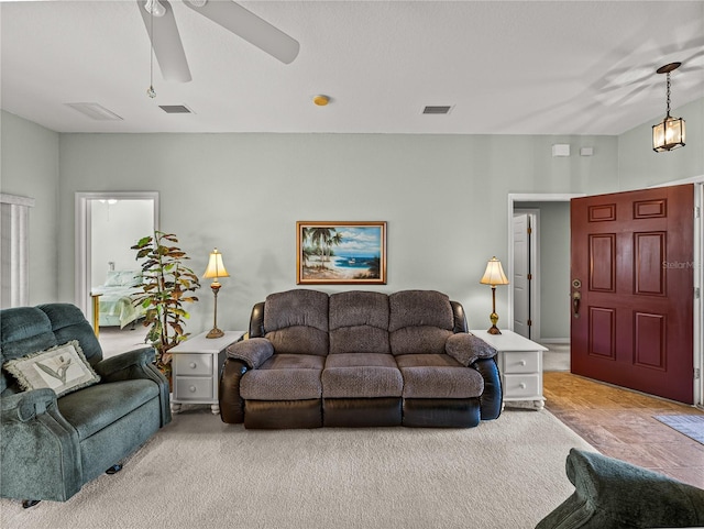 living room featuring light carpet and ceiling fan