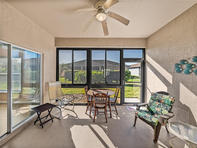 sunroom / solarium with ceiling fan