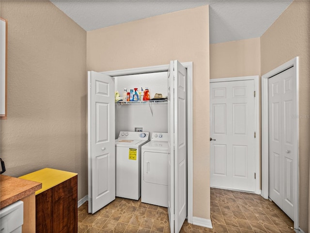 laundry room with separate washer and dryer