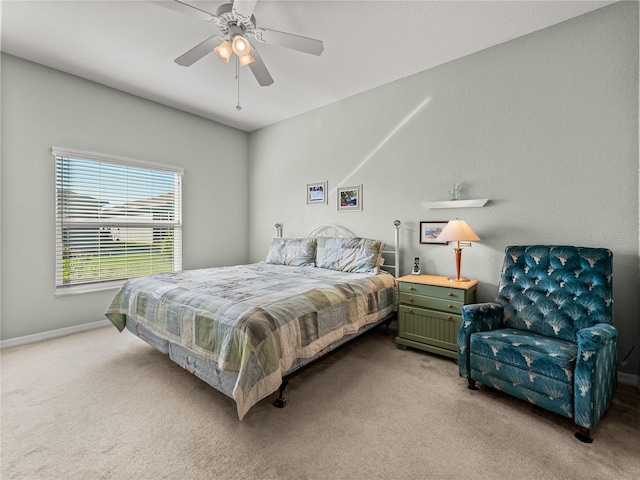 bedroom with light carpet and ceiling fan