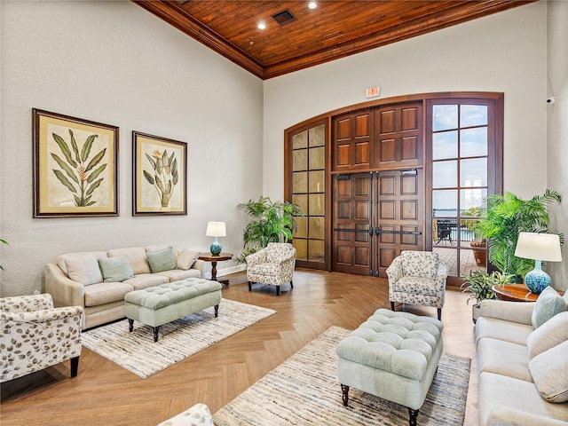 living room with wooden ceiling, light parquet floors, and a high ceiling