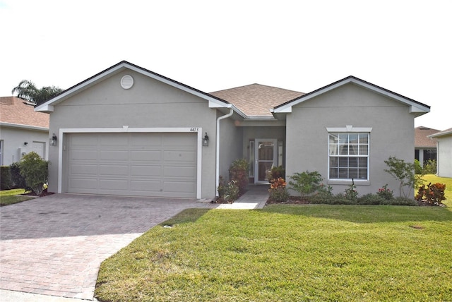 single story home with a garage and a front yard