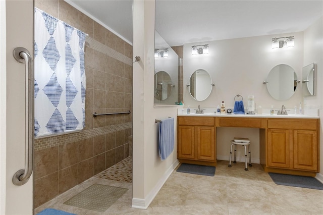 bathroom with tile patterned floors, vanity, and walk in shower