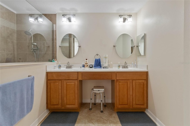 bathroom featuring vanity and tiled shower