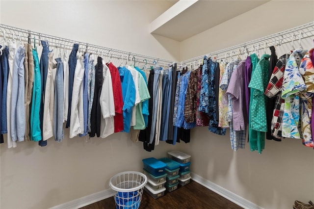 walk in closet featuring dark wood-type flooring