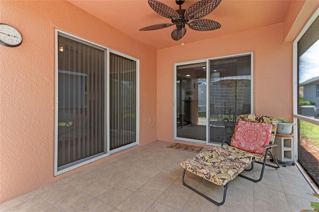 view of patio featuring ceiling fan